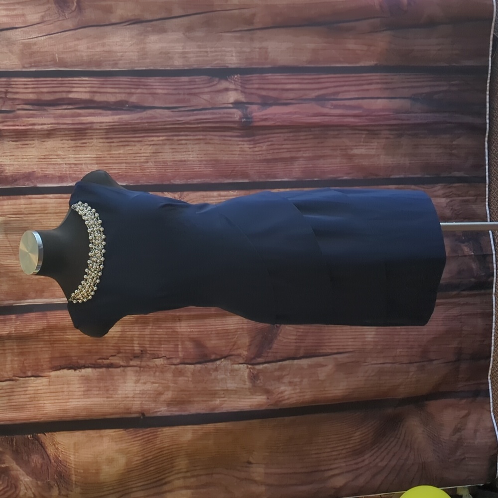 Size 8 navy dress with pearl beading across the top from Connected Apparel